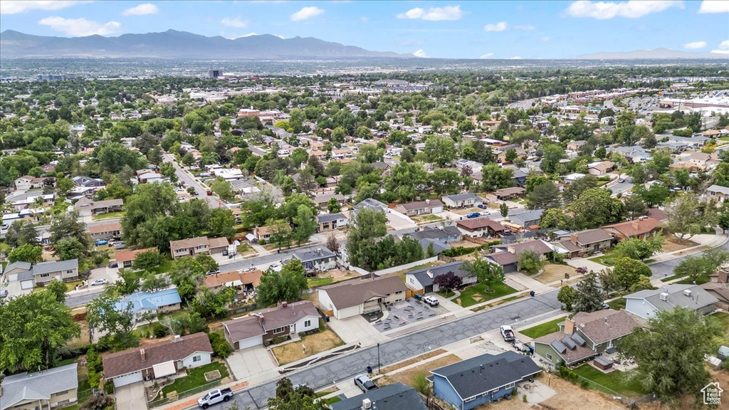 Aerial perspective of suburban area with a mountain backdrop