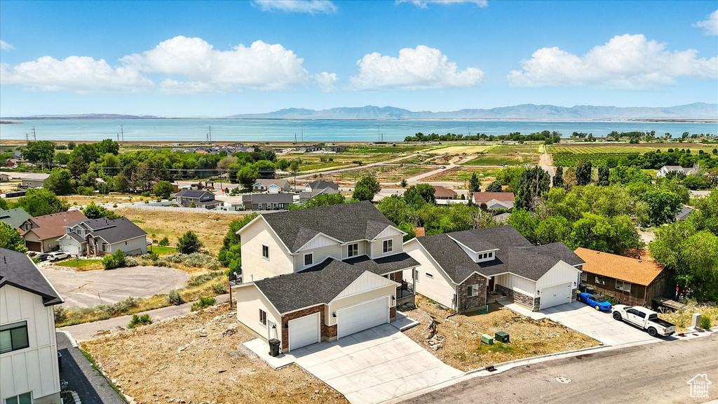 Aerial view of residential area featuring a water and mountain view