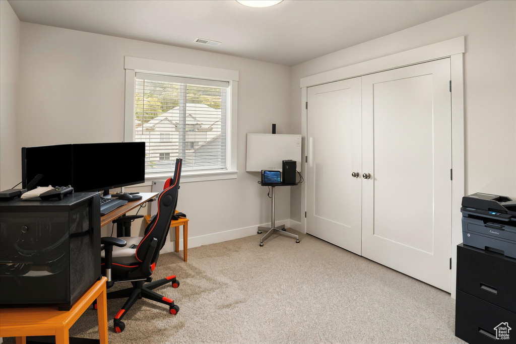 Office area featuring carpet and baseboards