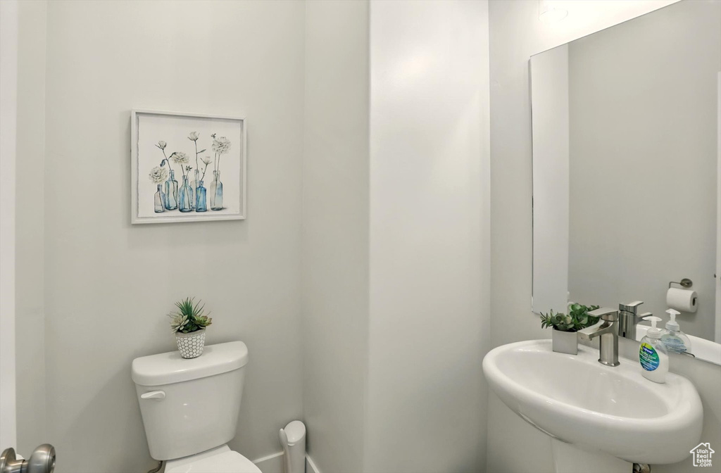Bathroom featuring toilet and a sink
