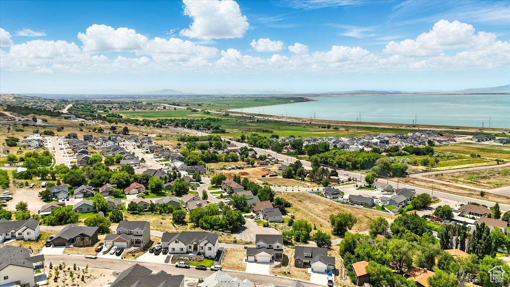 Aerial perspective of suburban area with a nearby body of water