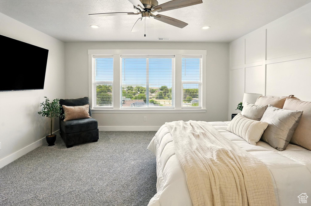 Bedroom featuring baseboards, carpet, recessed lighting, and a ceiling fan