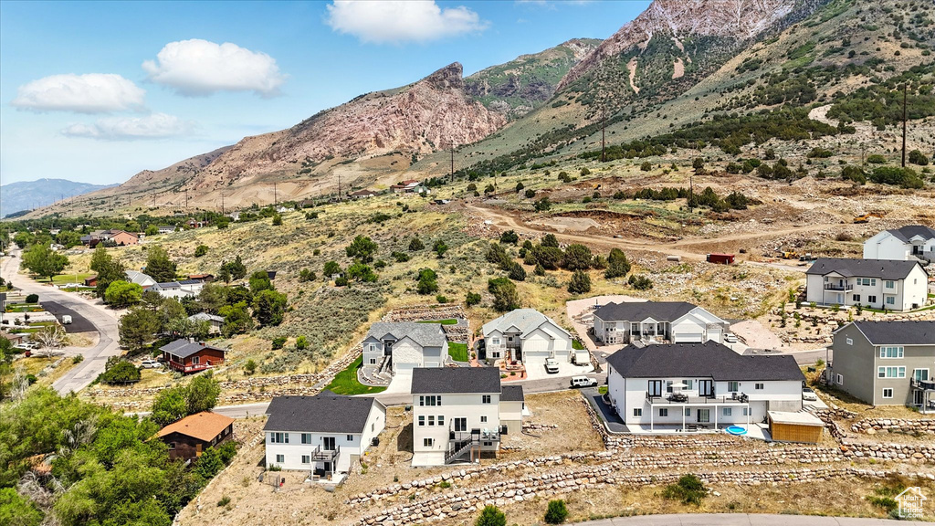 Aerial perspective of suburban area with a mountainous background