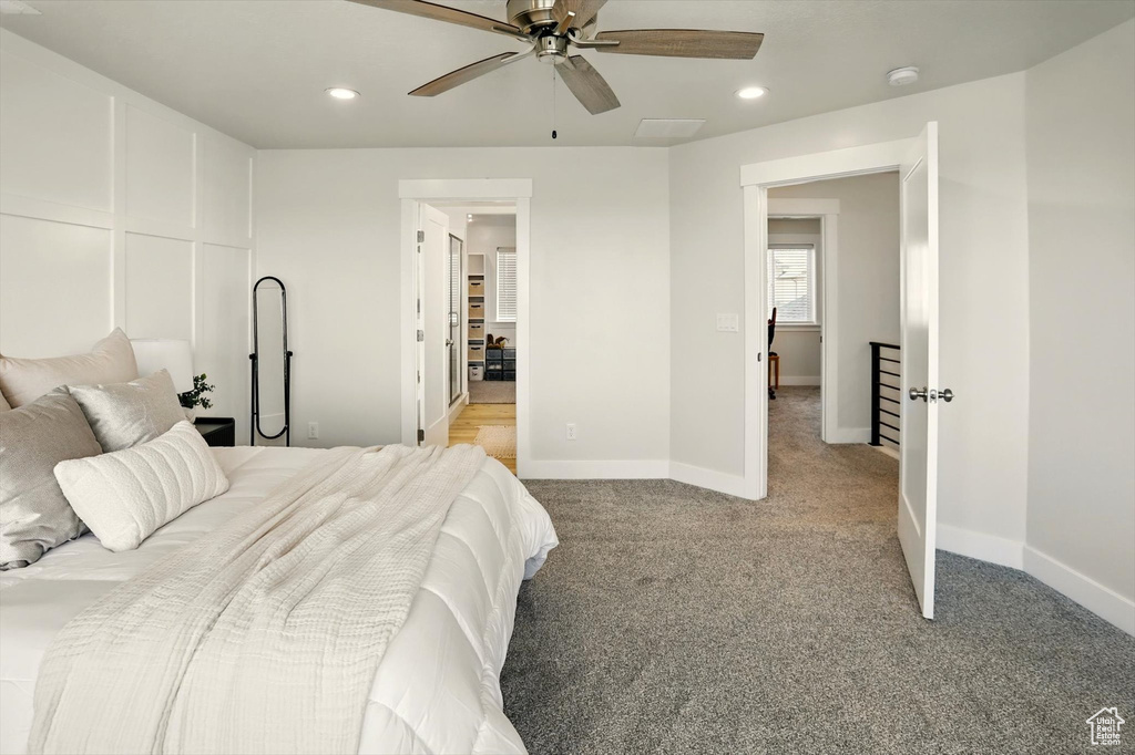 Bedroom featuring light colored carpet, recessed lighting, baseboards, and a ceiling fan