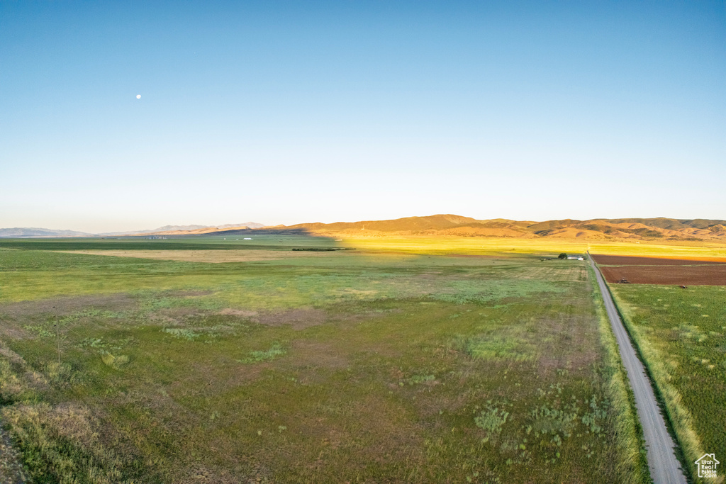 View of yard featuring a view of rural / pastoral area and a mountain view