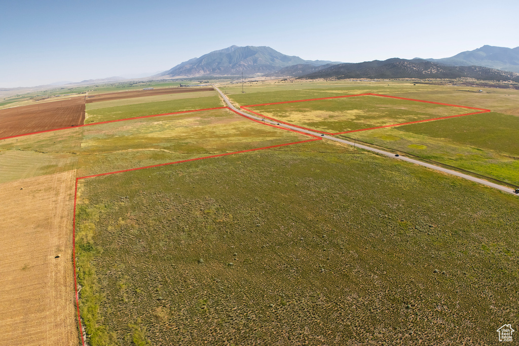 Overview of rural landscape featuring mountains and property parcel outlined