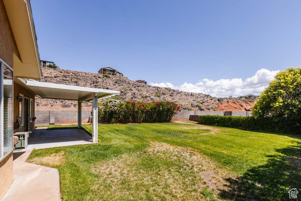 View of yard featuring a patio area and a mountain view