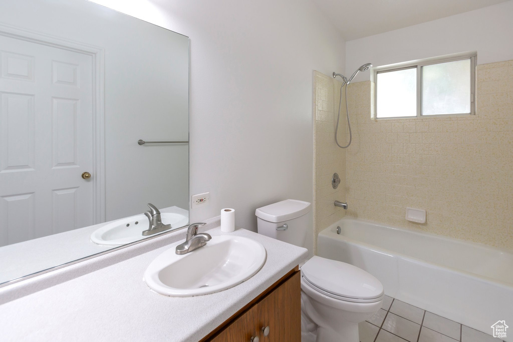 Full bath featuring vanity,  shower combination, and tile patterned flooring