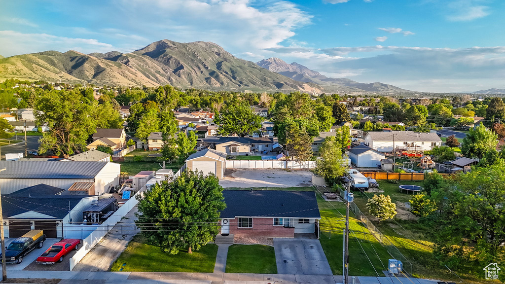 Aerial perspective of suburban area featuring a mountain backdrop