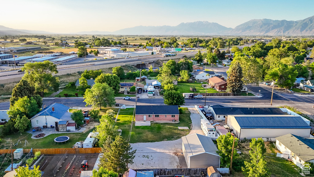 Aerial perspective of suburban area with a mountain backdrop