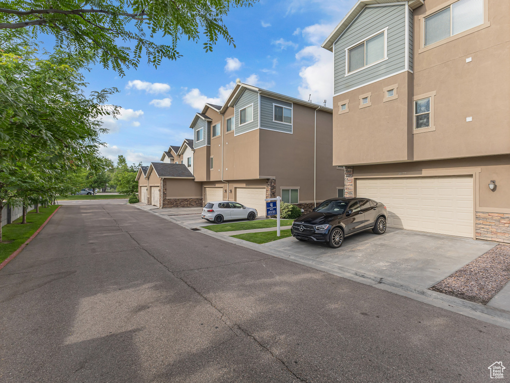 View of asphalt road with a residential view