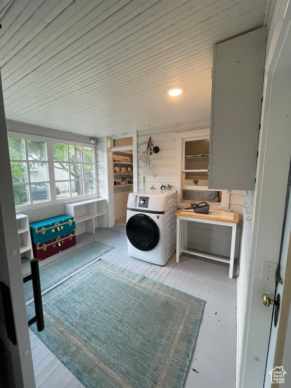 Laundry room featuring washer / dryer and wooden ceiling