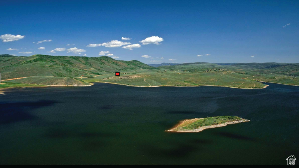 Mountain view featuring a large body of water