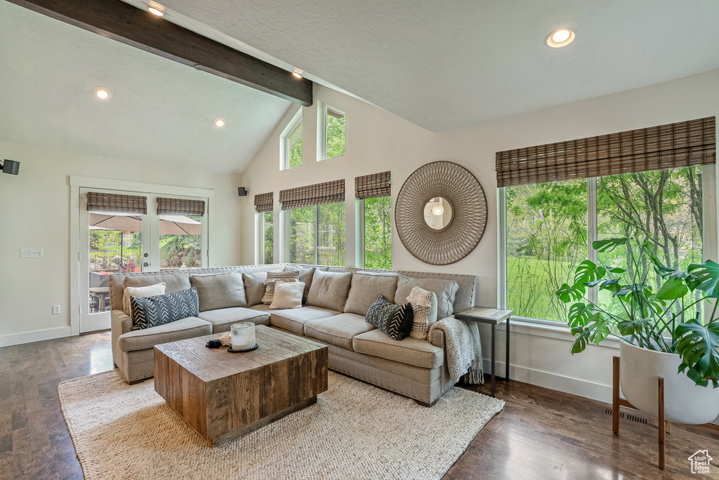 Living room featuring baseboards, wood finished floors, and recessed lighting
