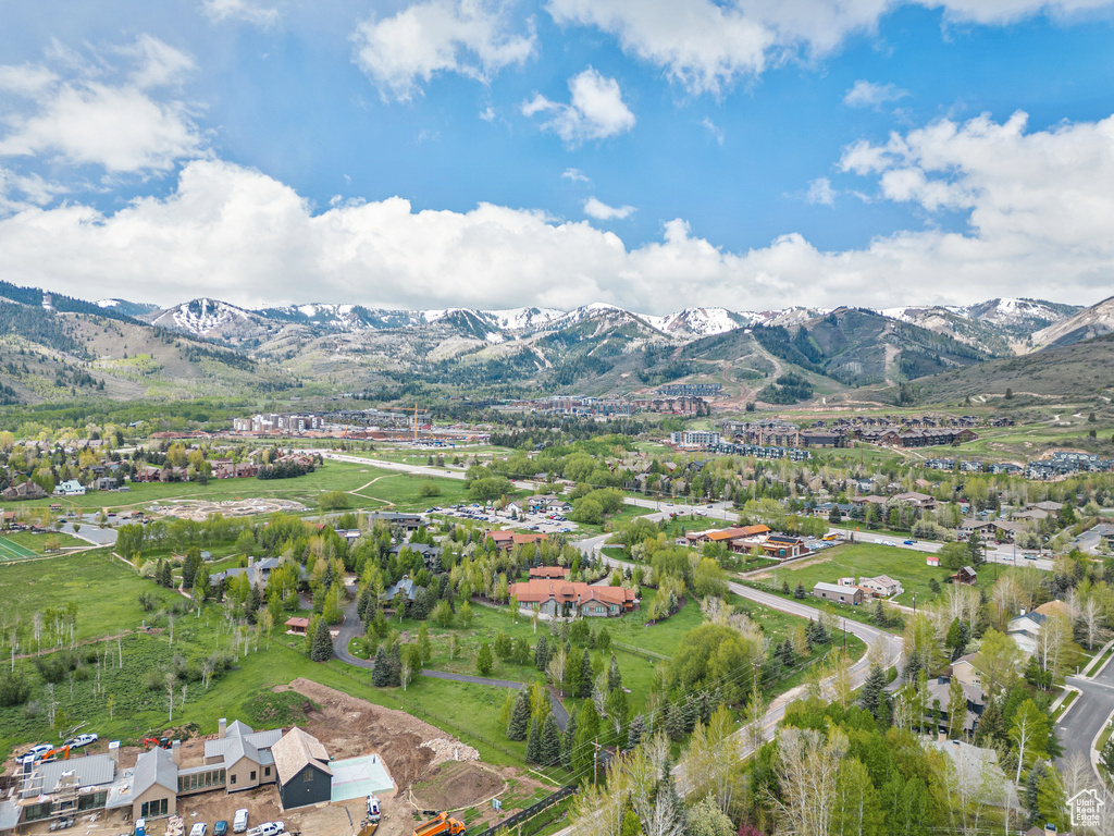 Aerial overview of property's location featuring a mountainous background