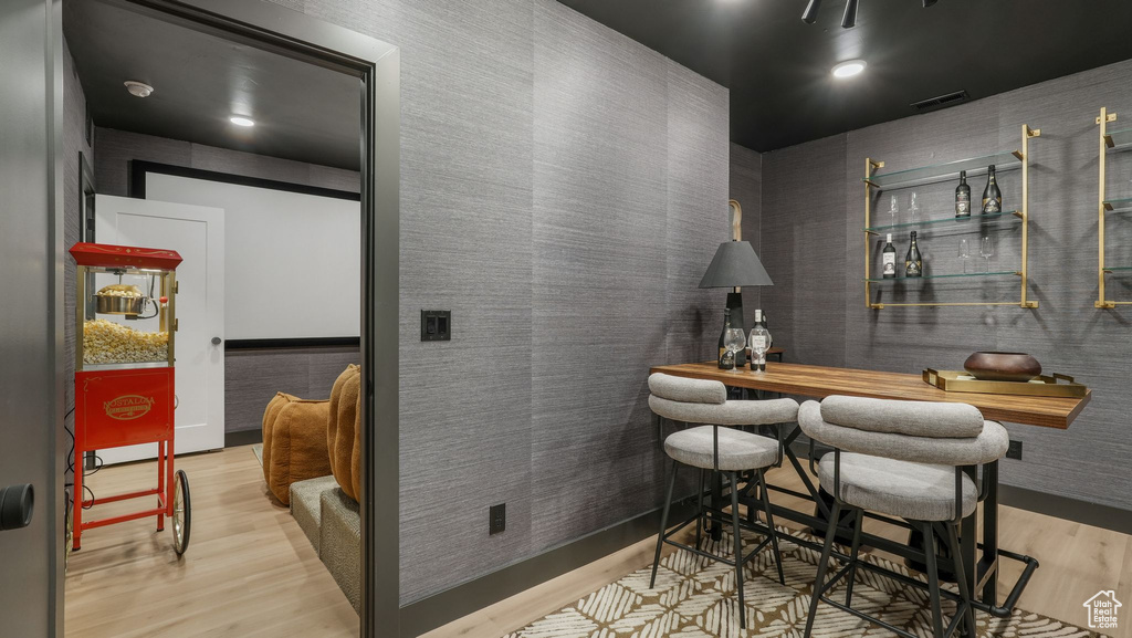 Indoor dry bar with wood finished floors