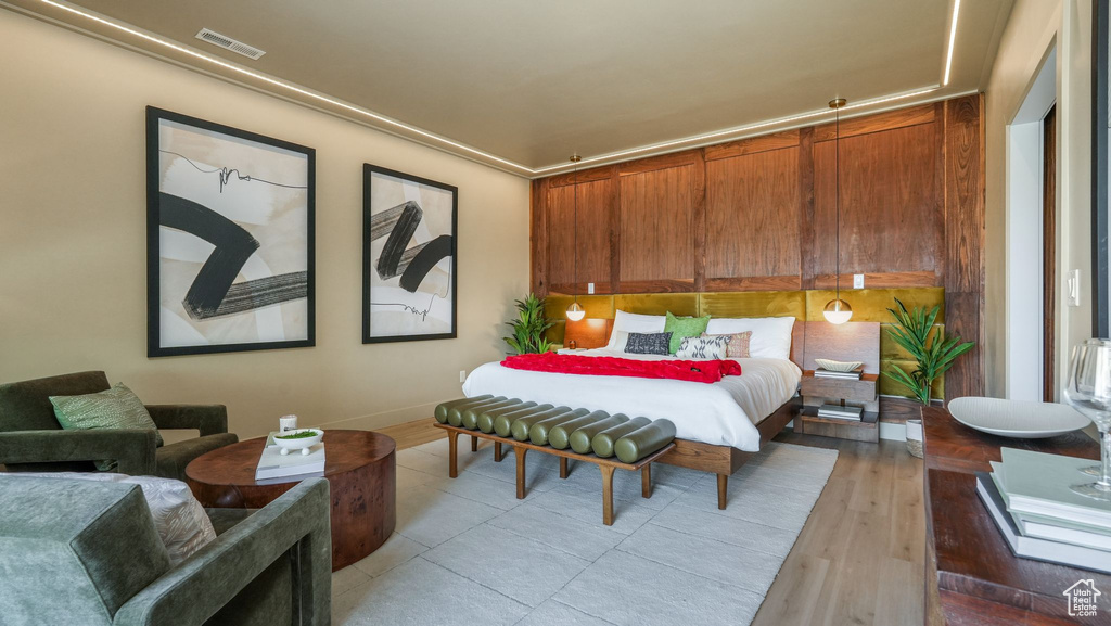 Bedroom featuring baseboards and light wood finished floors