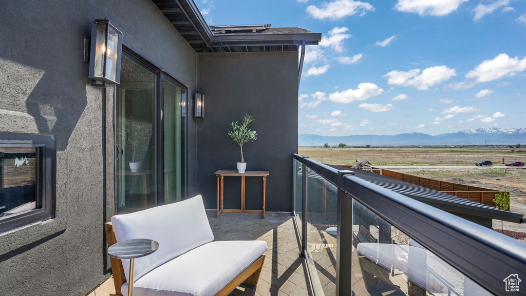 Balcony with a mountain view and a view of countryside