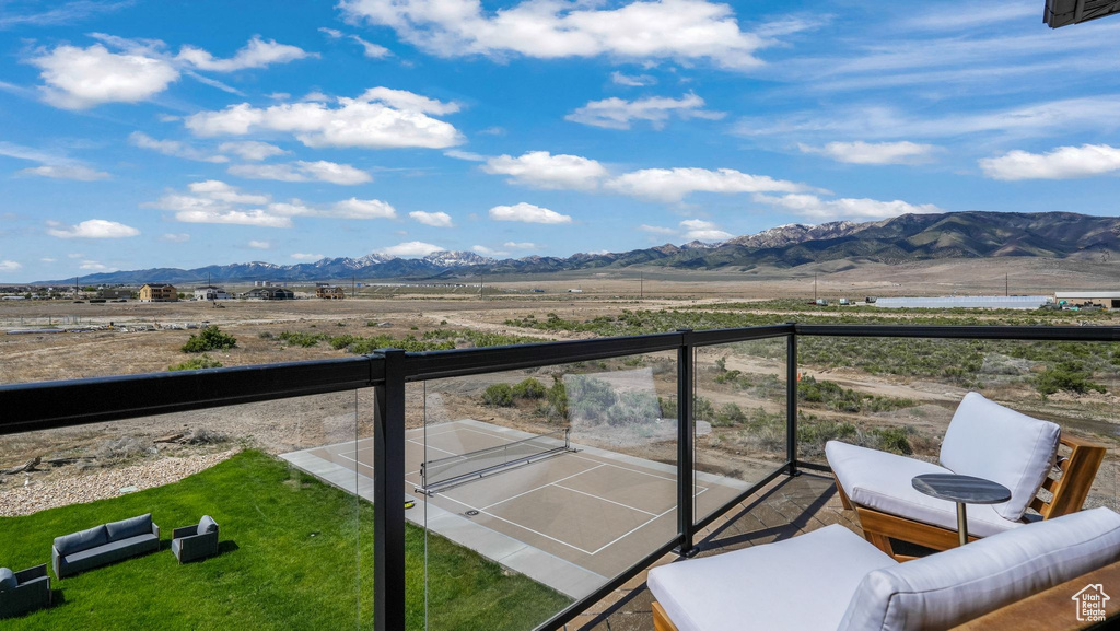 Balcony with a mountain view, a view of rural / pastoral area, and an outdoor hangout area