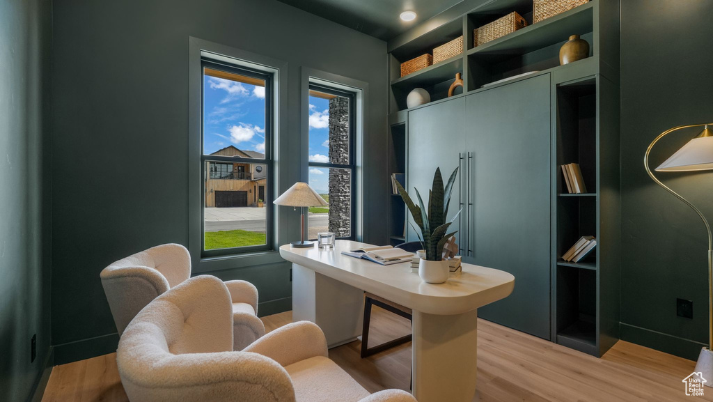 Office area with light wood finished floors and baseboards