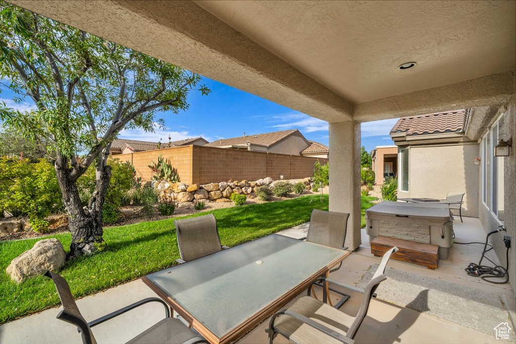 View of patio with outdoor dining area
