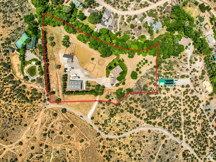 Aerial overview of property\\\'s location featuring property parcel outlined and a desert landscape