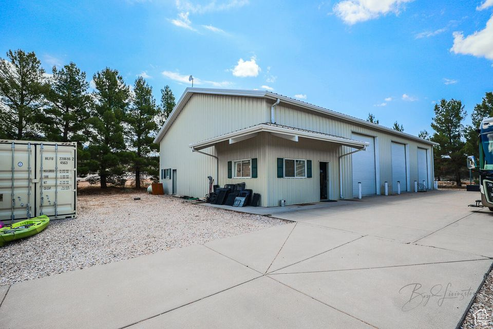 Rear view of house featuring a garage