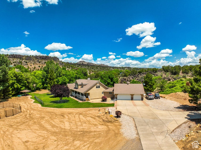 View from above of property with a mountain backdrop
