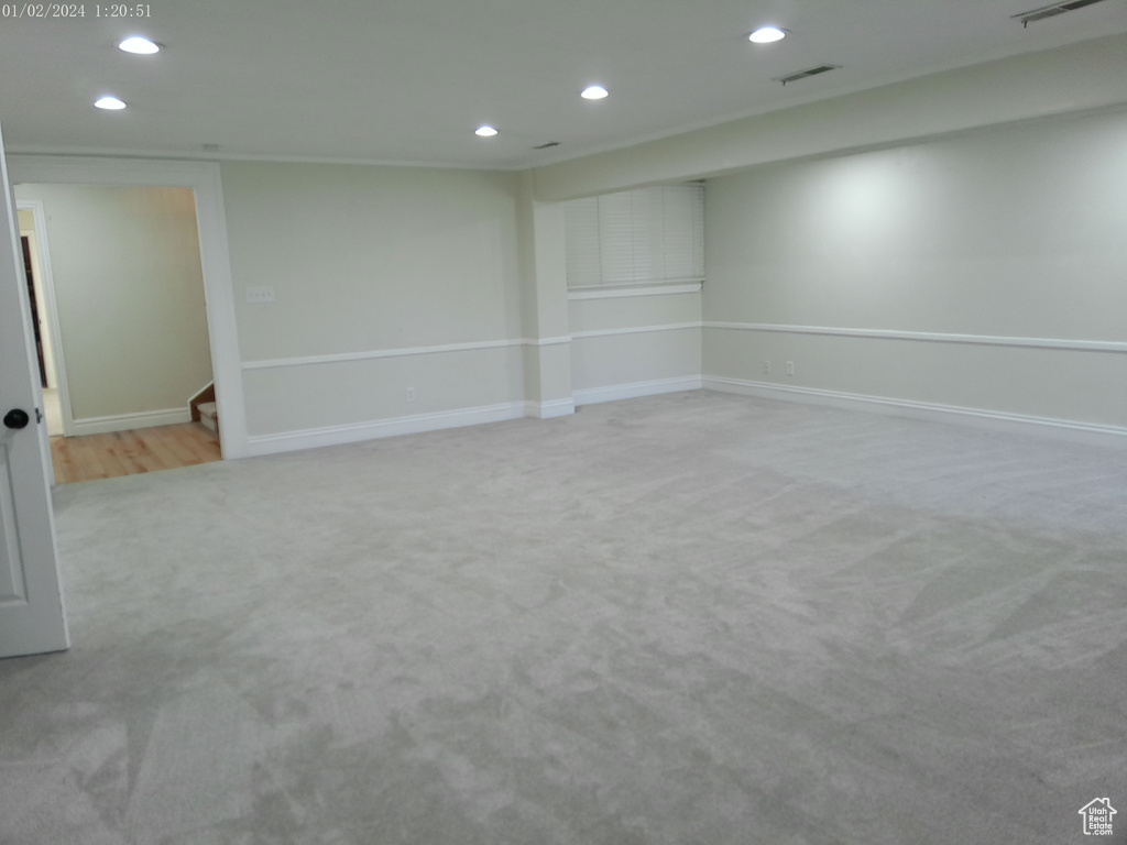 Finished basement featuring carpet, recessed lighting, baseboards, and stairway
