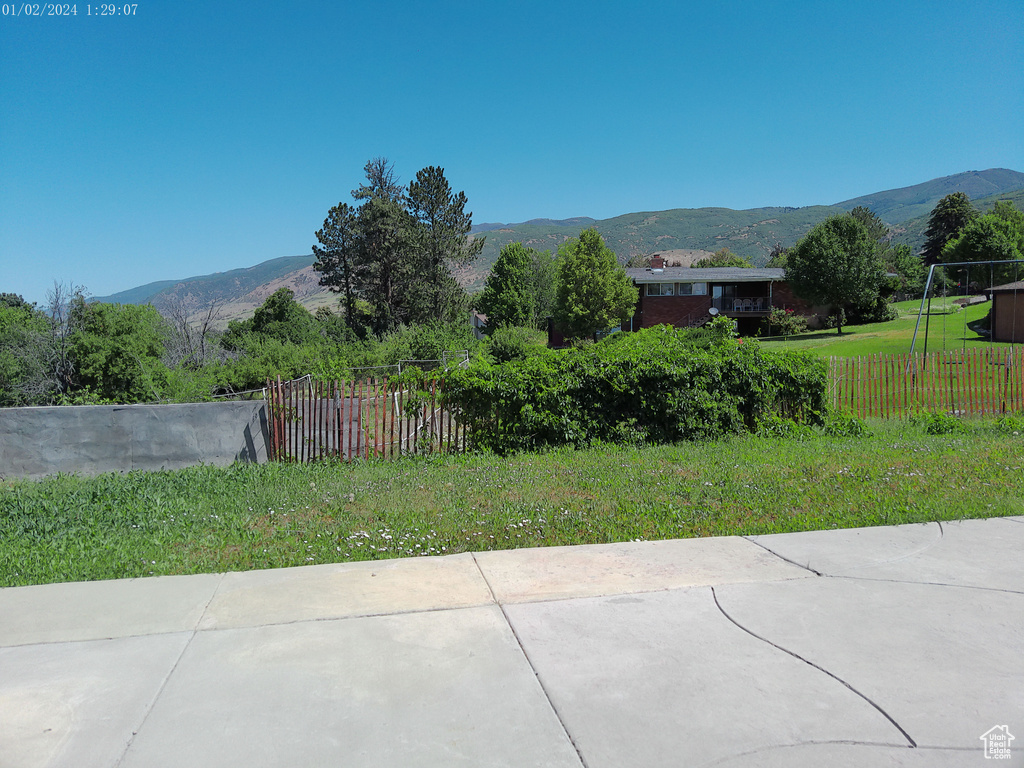 View of yard with a mountain view