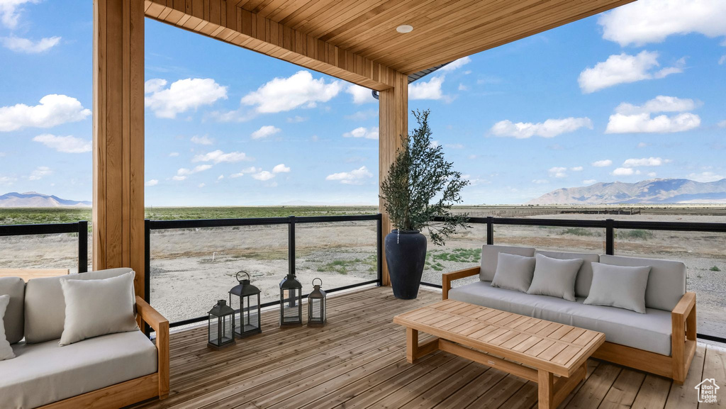Deck featuring a mountain view and outdoor lounge area