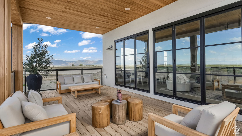 Balcony with outdoor lounge area and a mountain view