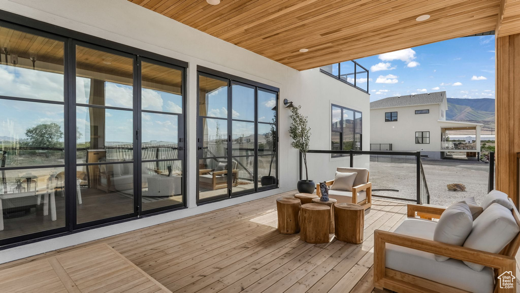 Sunroom / solarium featuring wooden ceiling and wood finished floors