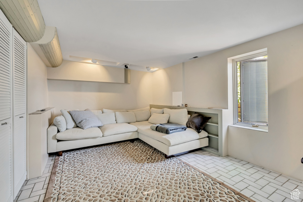 Living area featuring brick patterned flooring