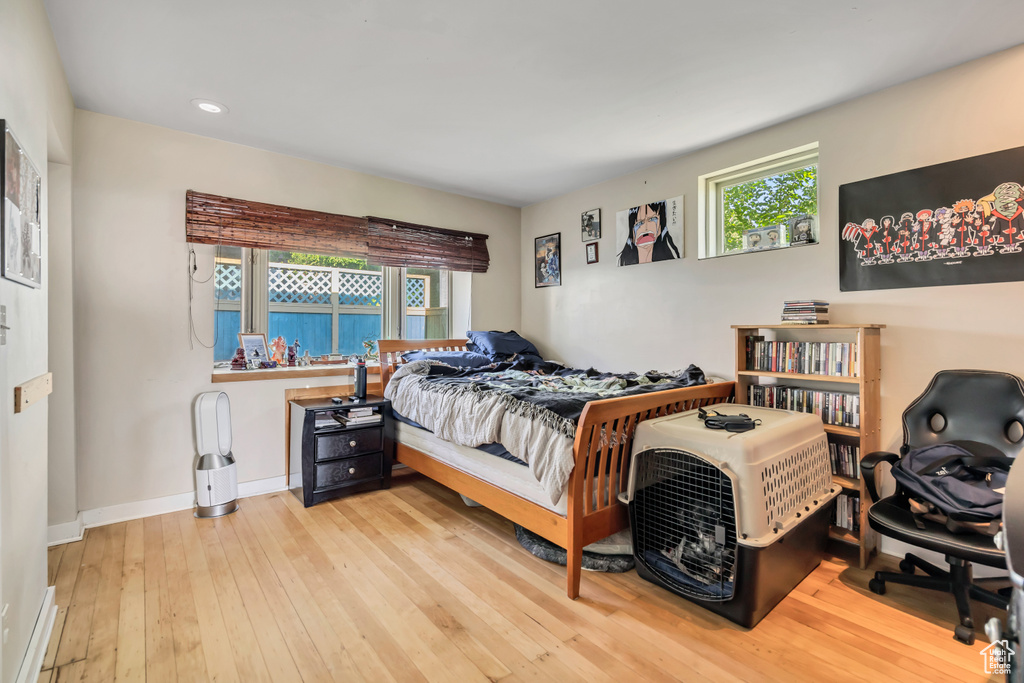 Bedroom featuring wood-type flooring, recessed lighting, and baseboards