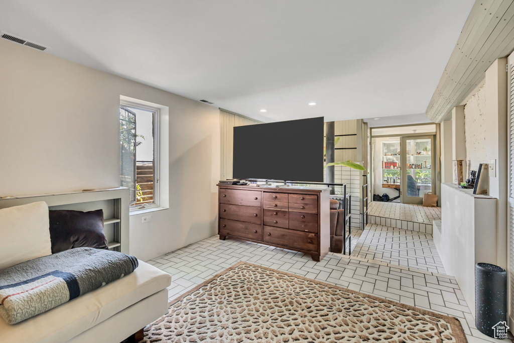 Living room featuring brick patterned flooring and recessed lighting