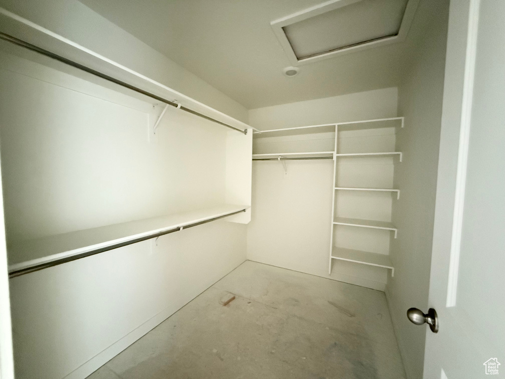 Walk in closet featuring attic access