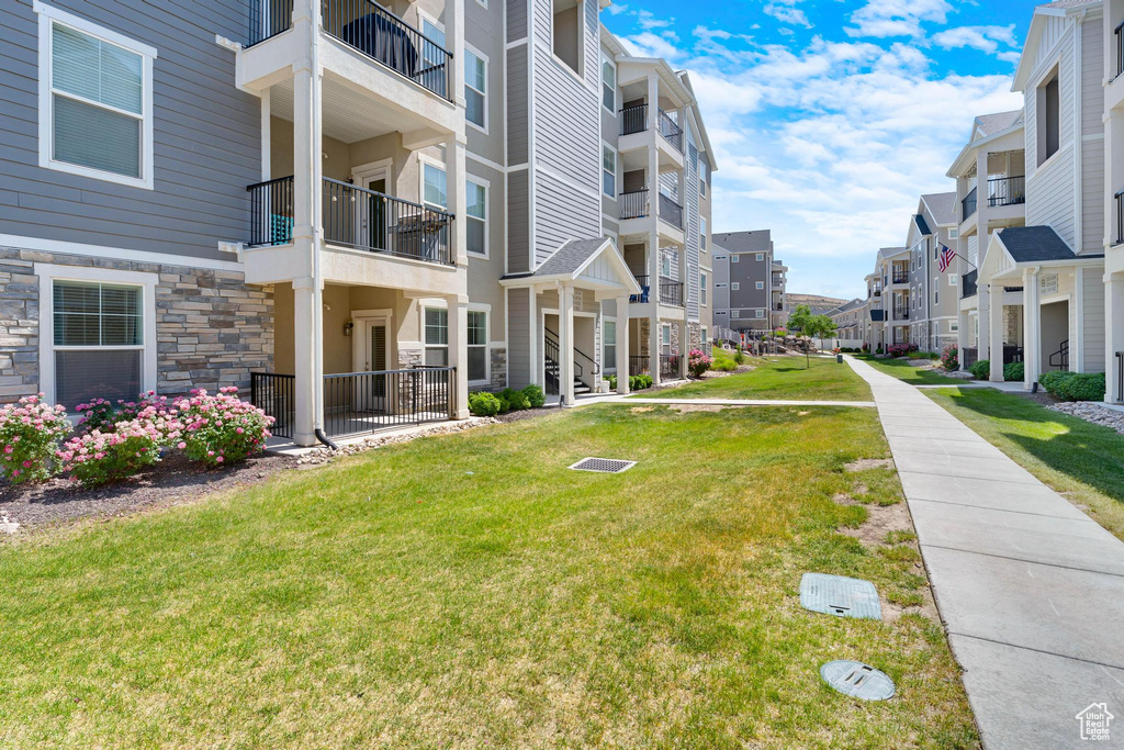 View of home\'s community featuring a residential view and a lawn