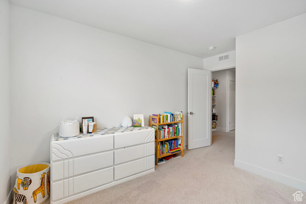 Bedroom with carpet flooring and baseboards