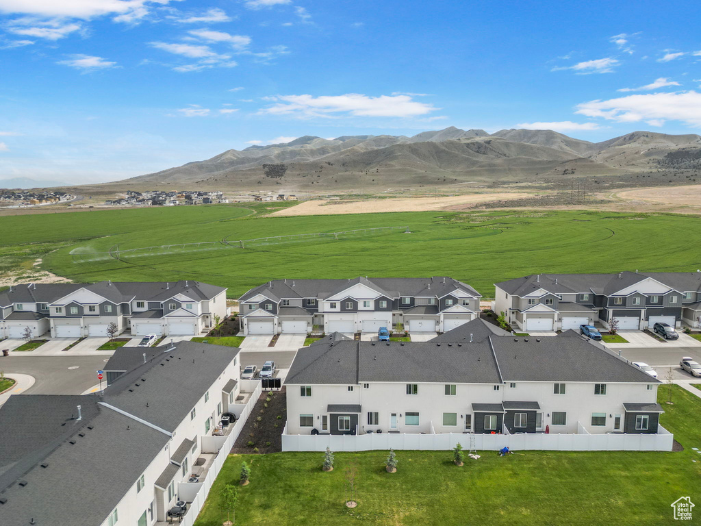 Aerial view of residential area featuring a mountain backdrop