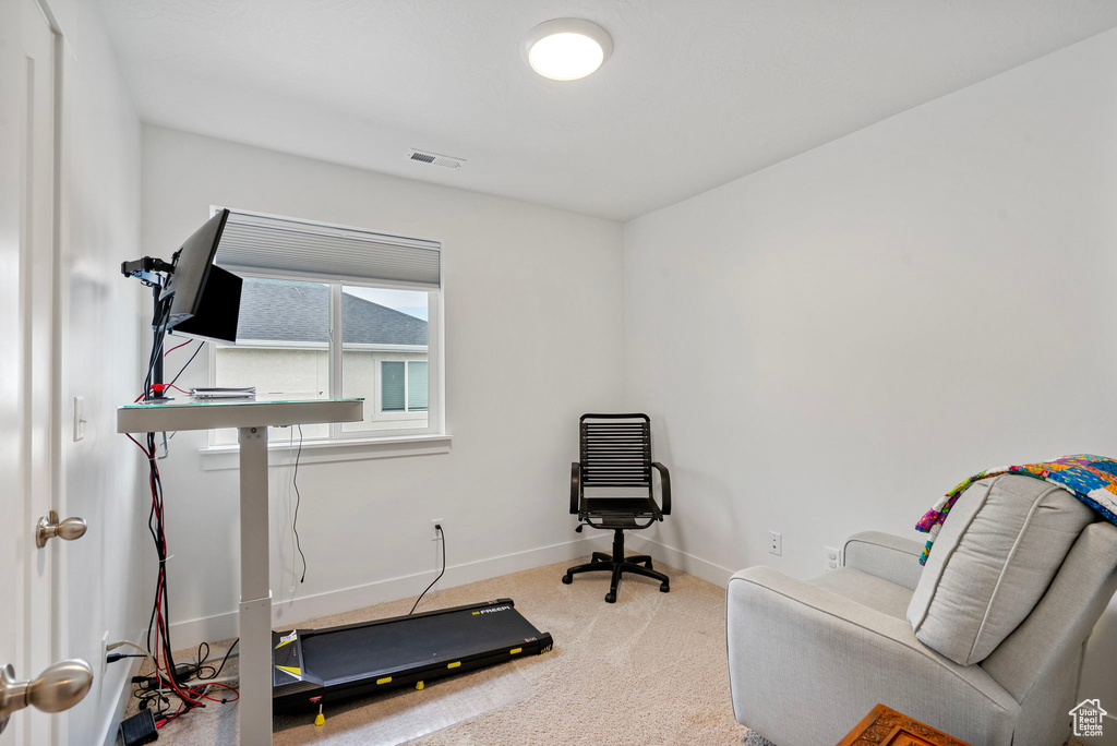 Exercise room with carpet and baseboards