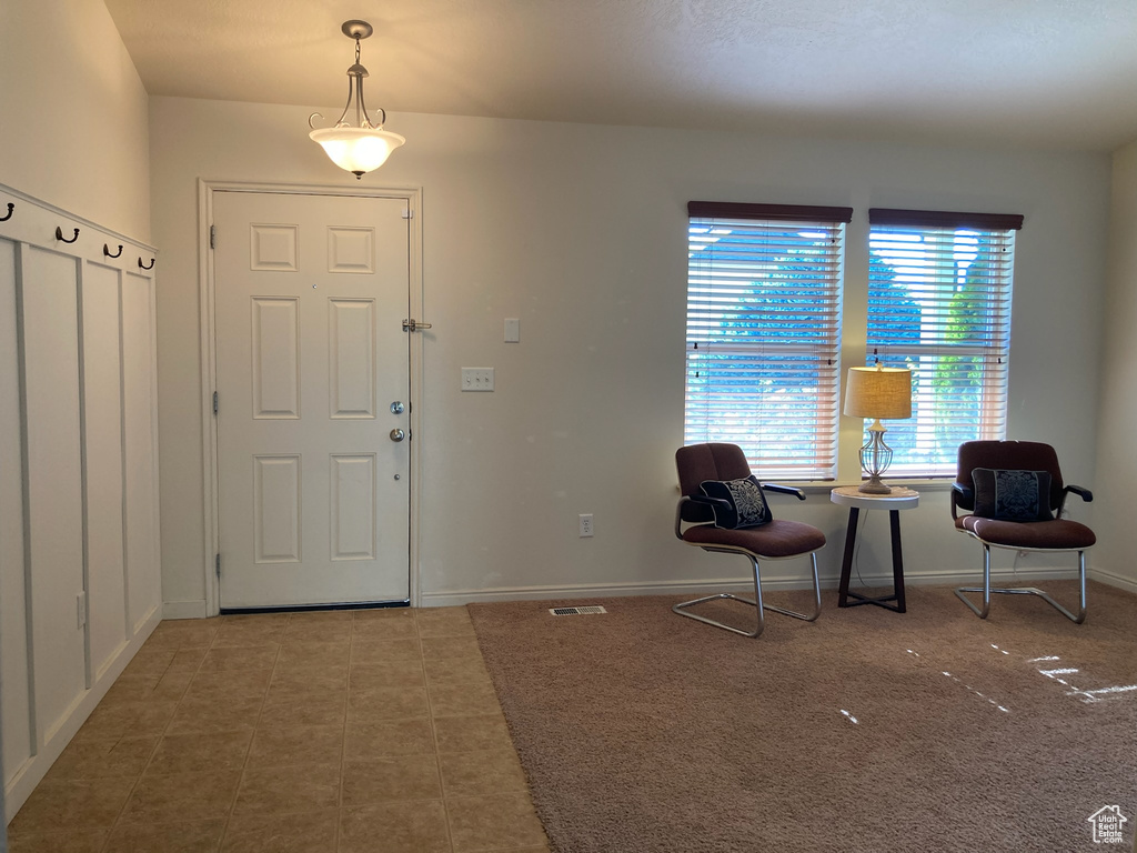 Foyer entrance with baseboards