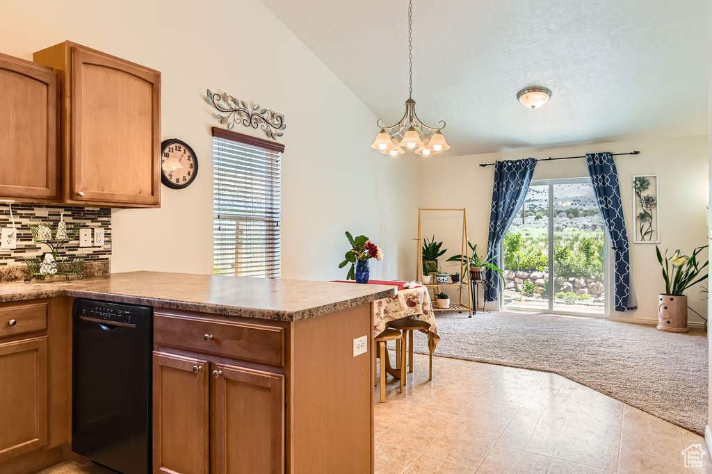 Kitchen featuring black dishwasher, light colored carpet, a chandelier, decorative backsplash, and a peninsula
