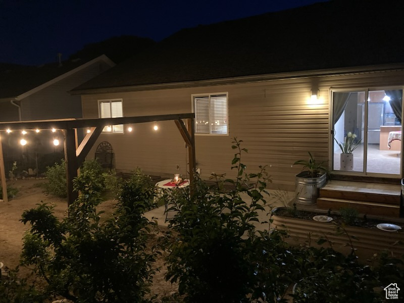 View of property exterior at twilight