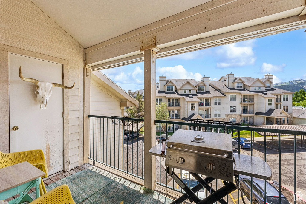 Balcony with a residential view and area for grilling