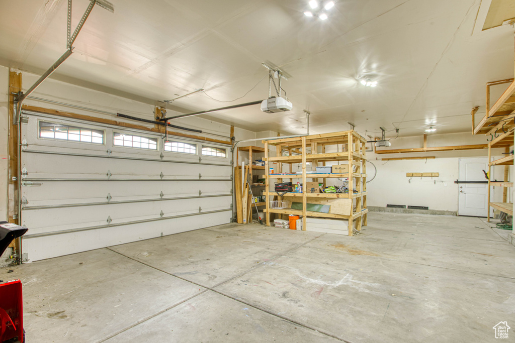 Garage featuring a garage door opener