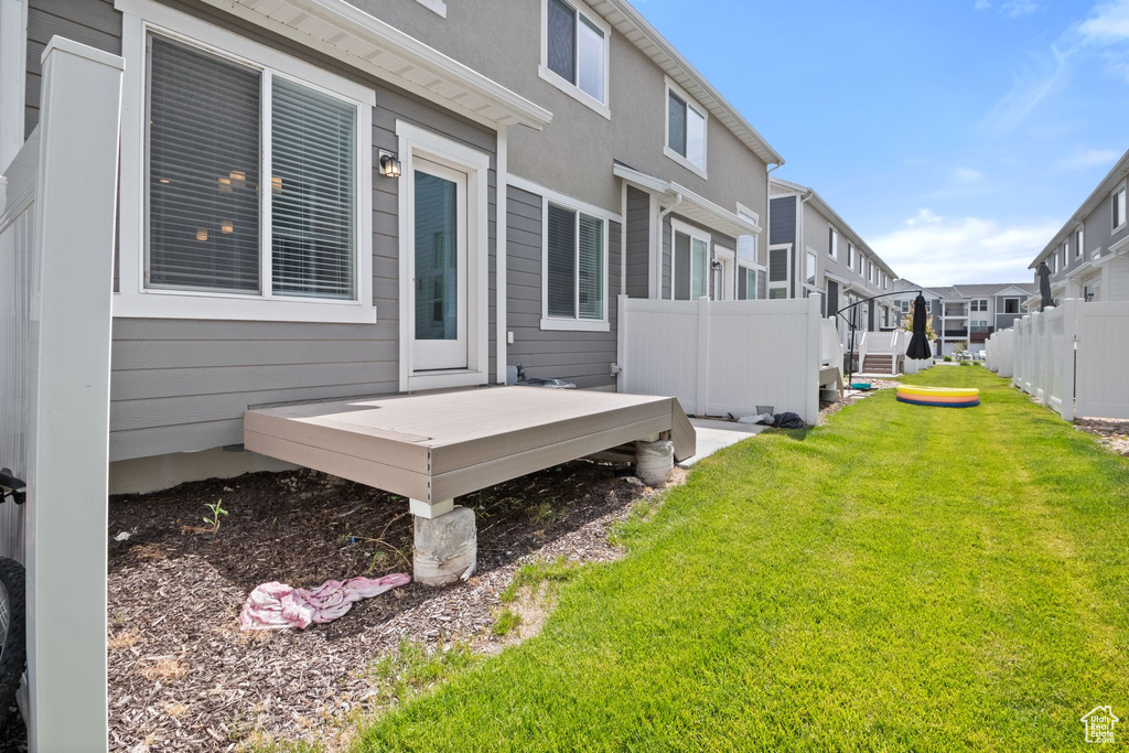 View of yard with a residential view and a wooden deck
