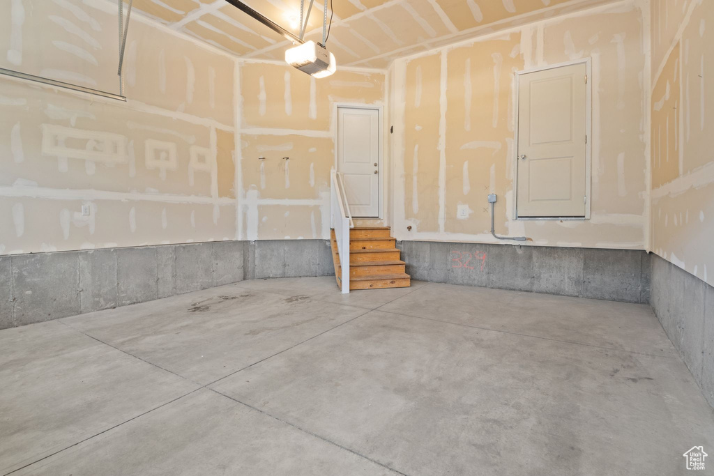 Garage featuring a garage door opener
