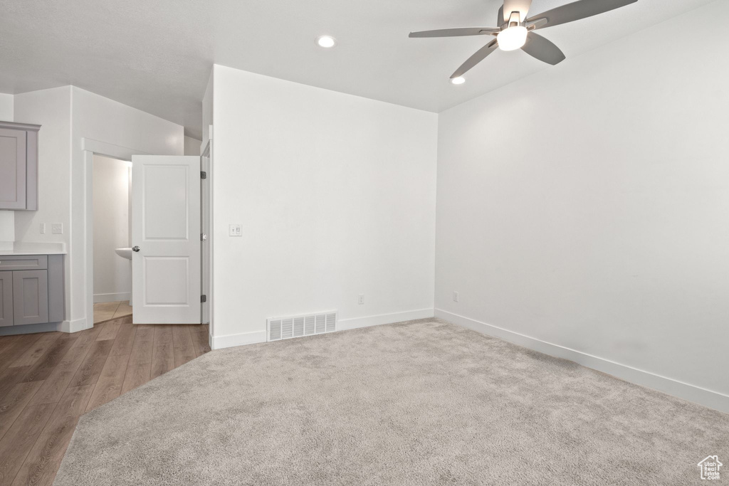 Spare room featuring ceiling fan, recessed lighting, baseboards, and wood finished floors