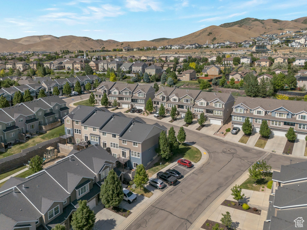 View of property location featuring mountains and nearby suburban area